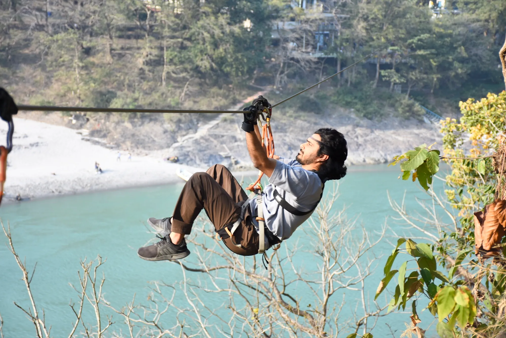 Zipliner crossing high above the Ganges