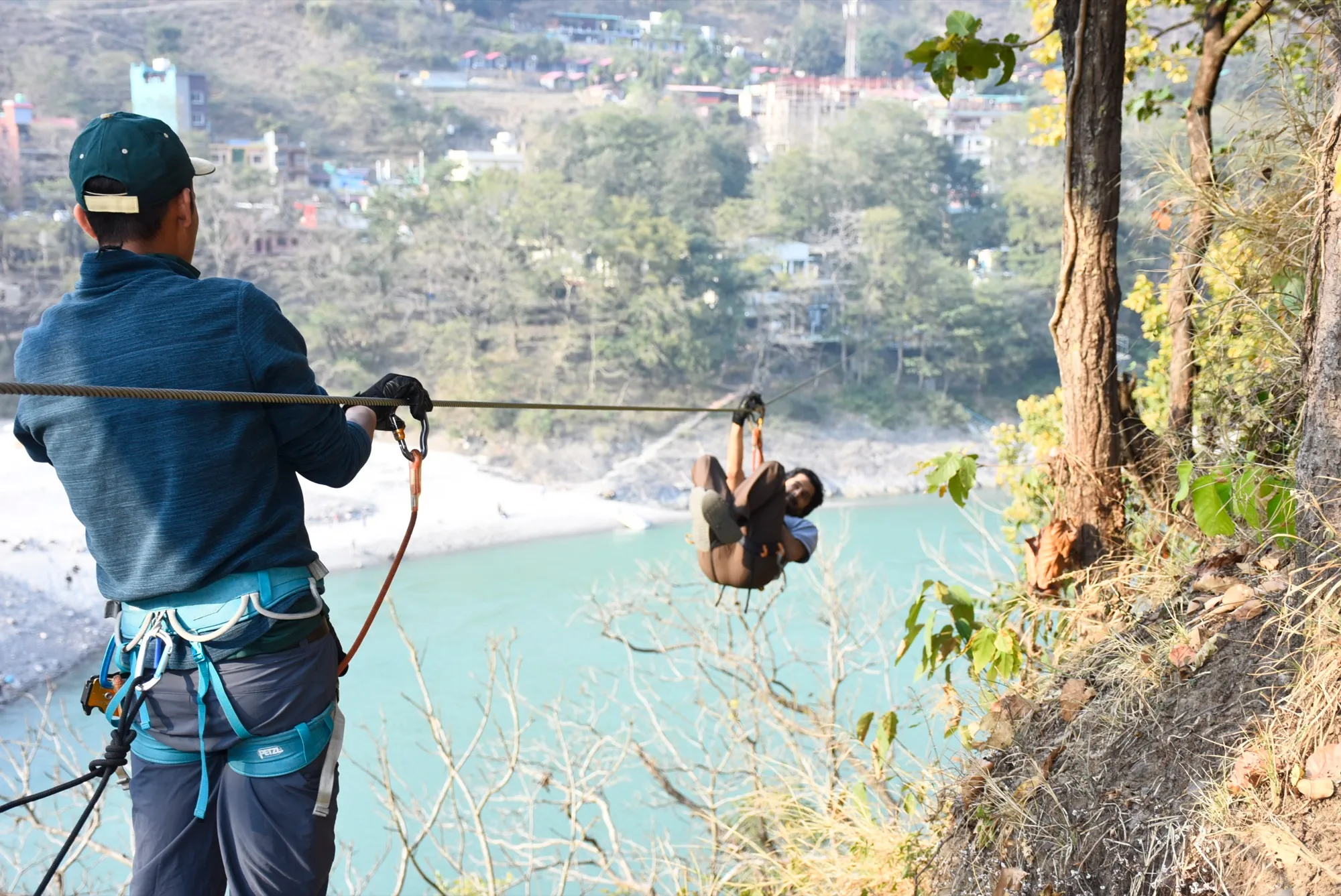 A guest hanging upside down on the zipline for fun